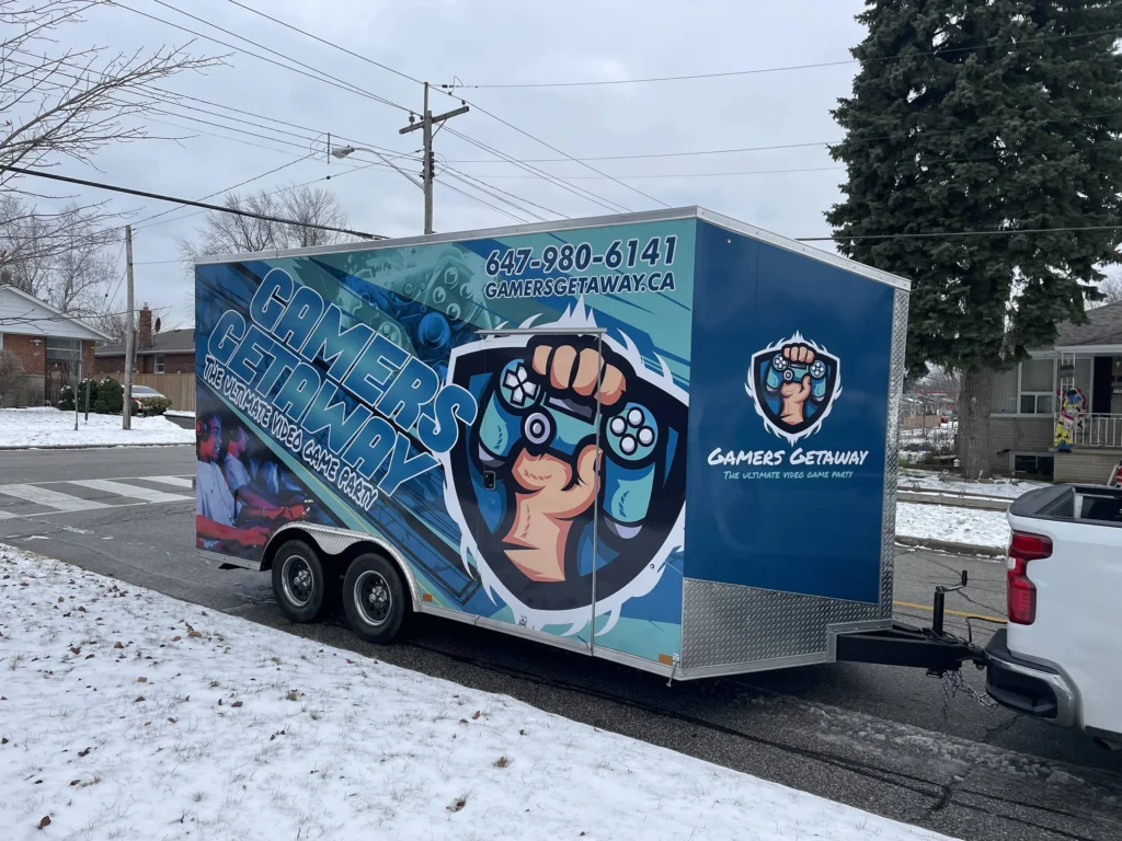 The Gamers Getaway video game trailer and pickup truck parked on a snowy Toronto street