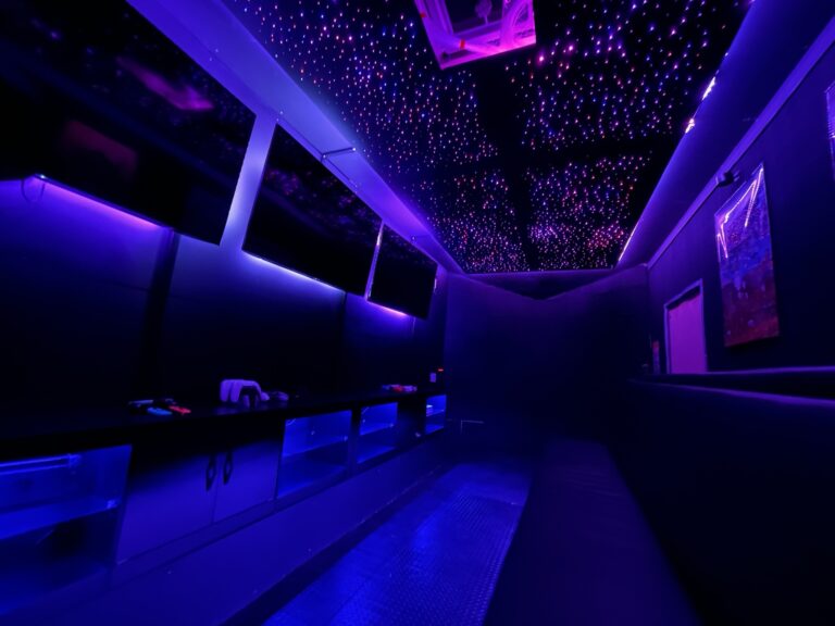Empty video game trailer lit with purple LED lighting before a party