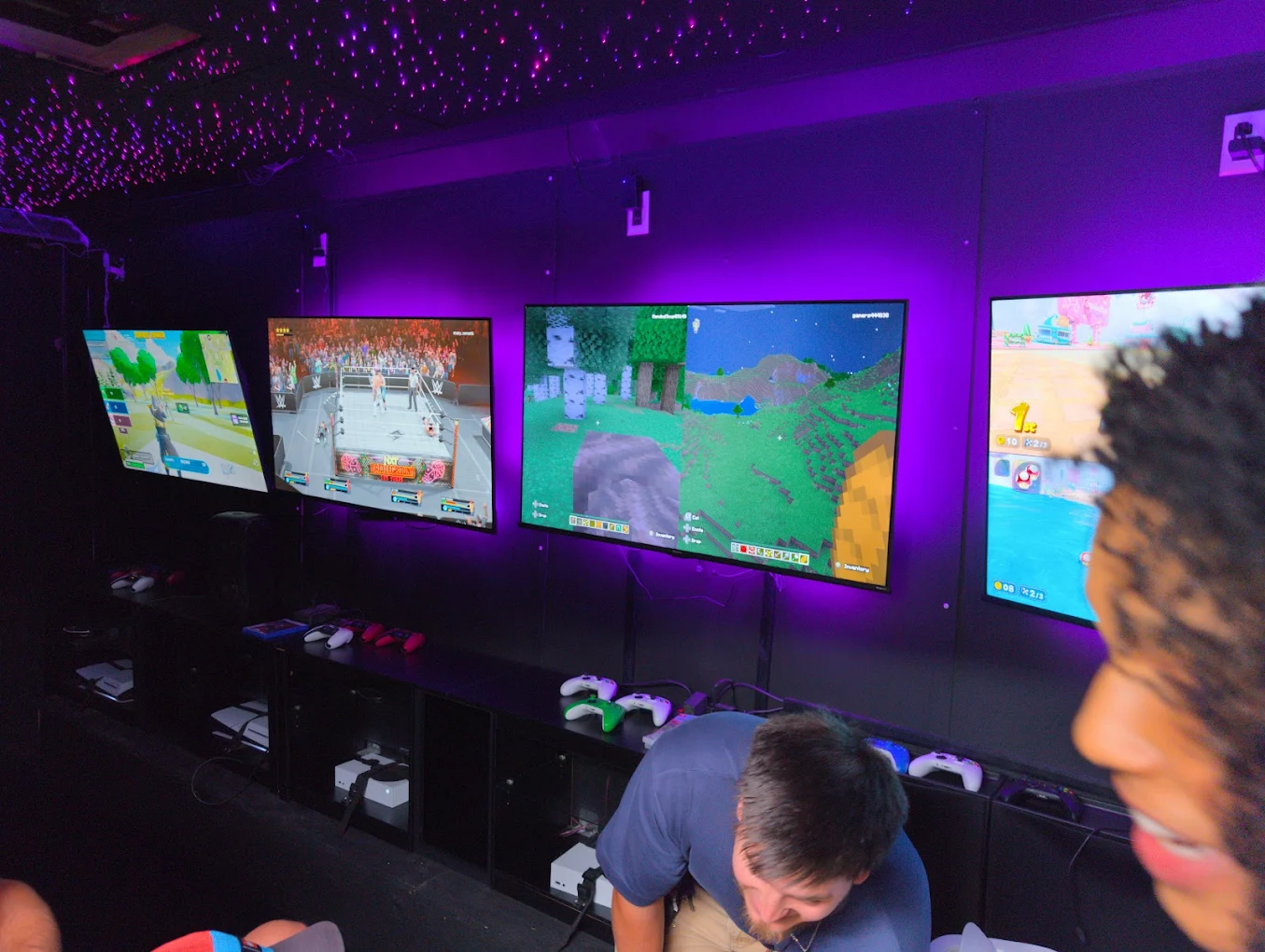 Adults gaming inside the truck at a company family day
