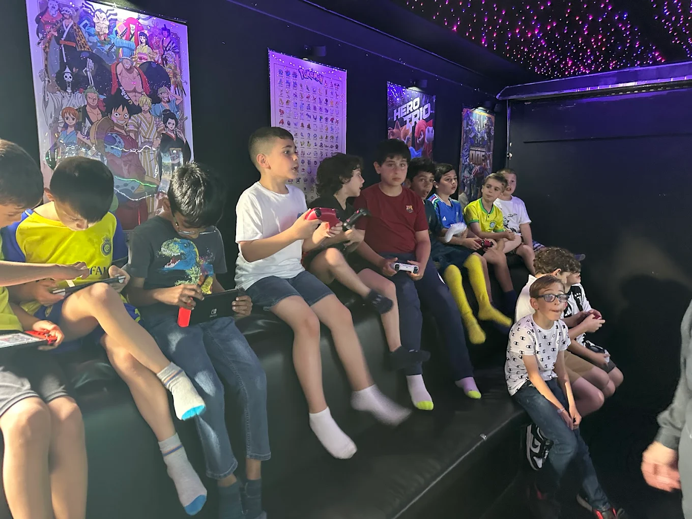 A full truck of kids playing video games at a Gamers Getaway party